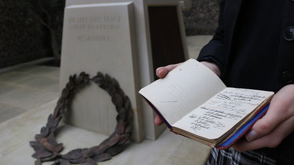 Pupil-holding-diary-from-WW1-project-Brighton-College-Remembers.jpg